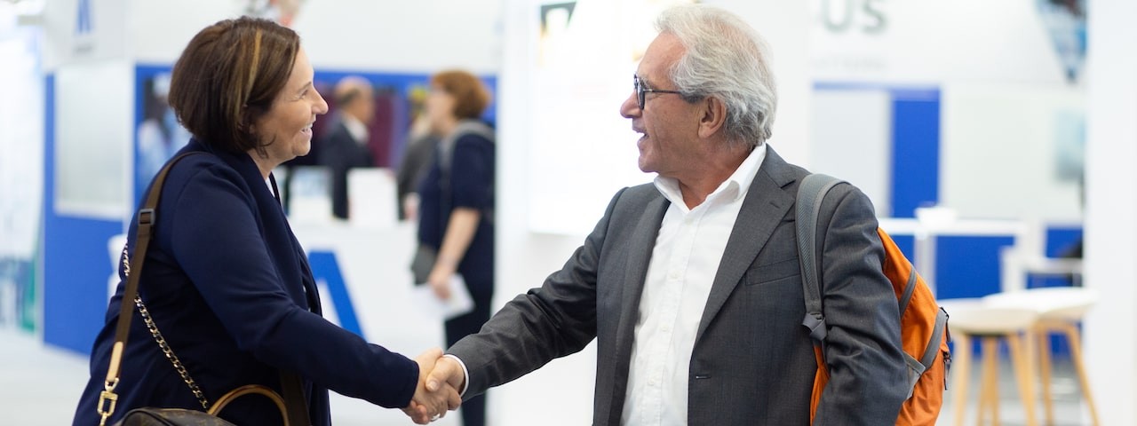Two attendees handshaking at CPHI Barcelona 